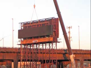 New concrete foundation support the additional weight of the LED sign cabinets