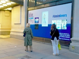 Advertising in-window display at Selfridges in London