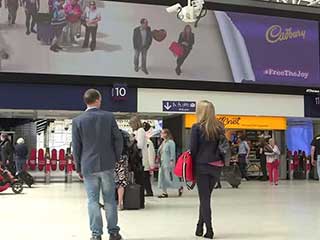 Digital interactive acquaintance at the LED screen in Waterloo Station (London, UK)