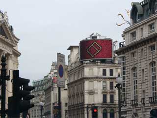 Outdoor advertizing screen in London on the cross-section of Oxendon and Coventry streets