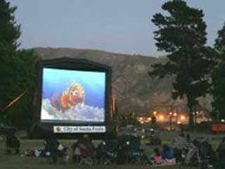 Summer evening outdoor movie on inflatable screen