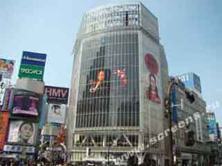 The glass-covered video LED screen on the façade of the commercial center