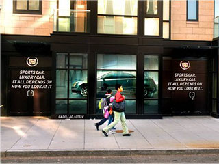 The display behind the window of Cadillac car dealership