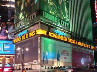 Times Square with its Dow Jones zipper and Accuweather's report